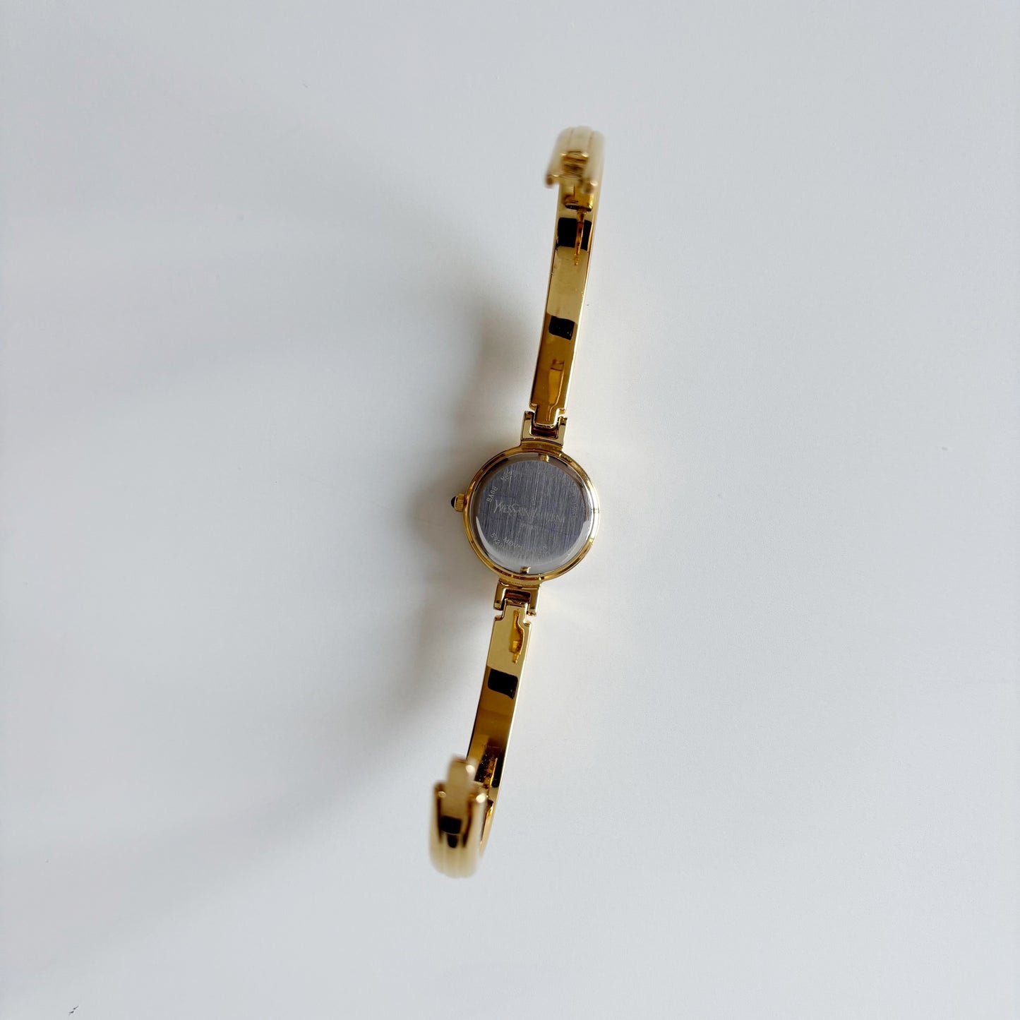 Yves Saint Laurent 1990s Black Round Dial Gold Plated Bangle Watch