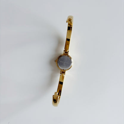 Yves Saint Laurent 1990s Black Round Dial Gold Plated Bangle Watch