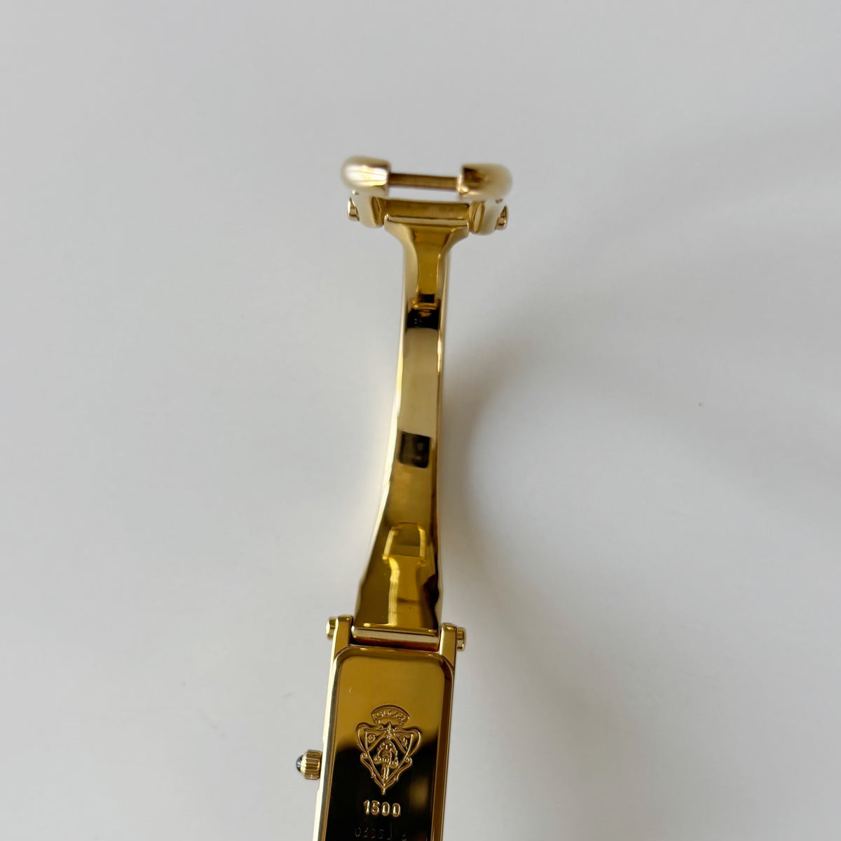 Gucci 1990s Rectangular Gold Dial Gold Plated Bangle Watch