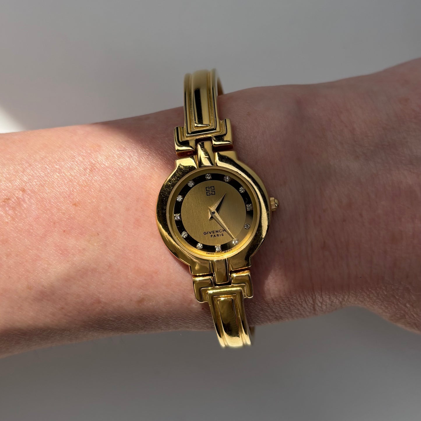 Givenchy 1990s Round Dial Gold Plated Bangle Watch