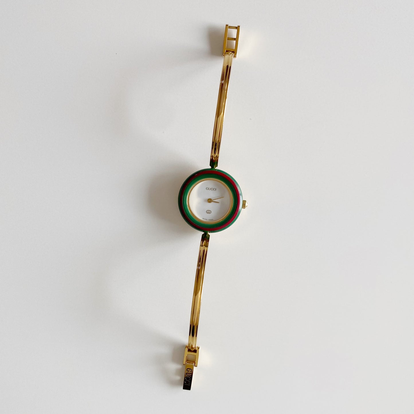 Gucci 1990s Interchangeable Bezel Gold Plated Bangle Watch with 12 bezels, case