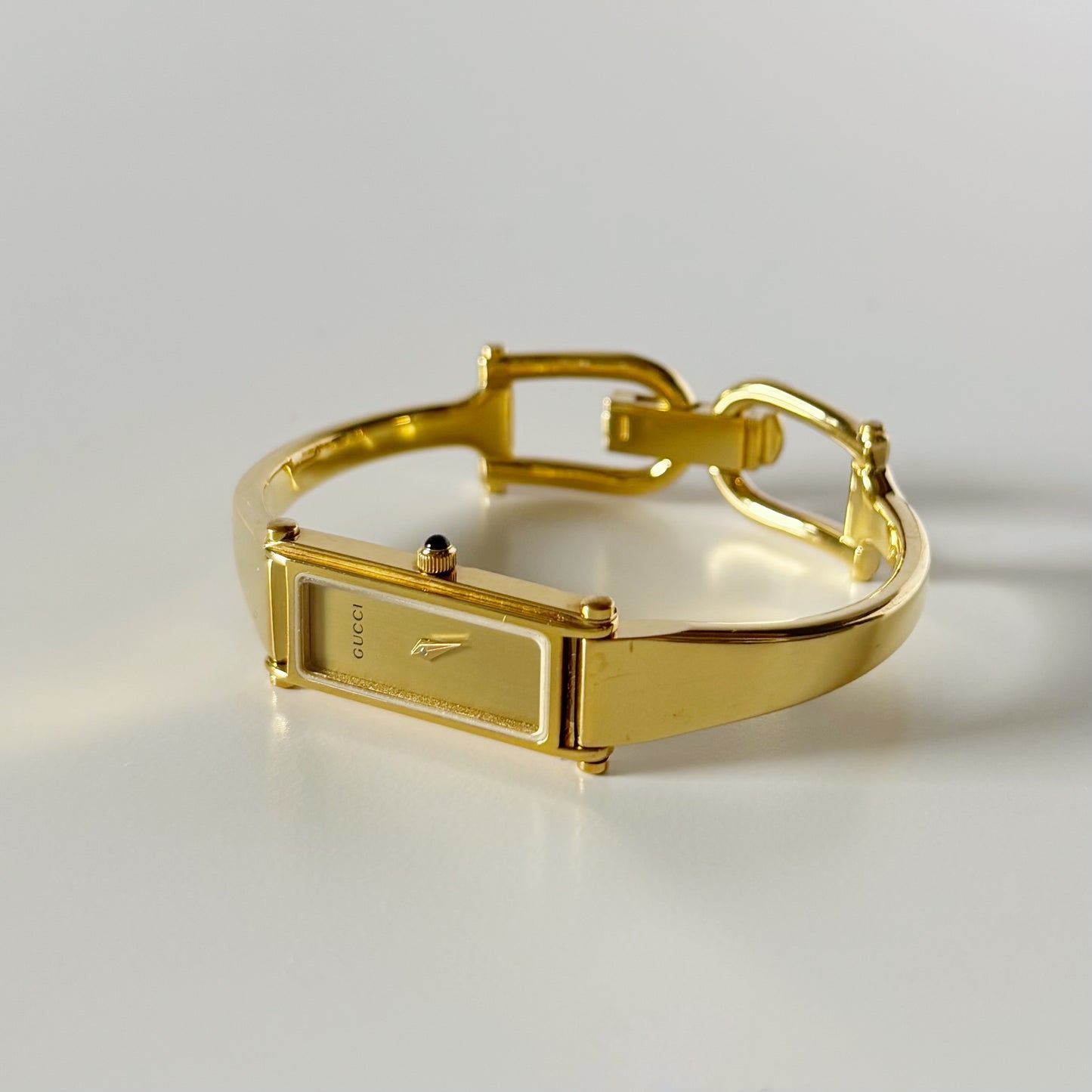 Gucci 1990s Gold Rectangular Dial Gold Plated Bangle Watch