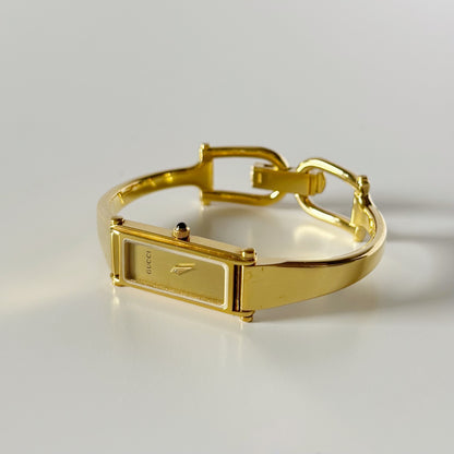 Gucci 1990s Gold Rectangular Dial Gold Plated Bangle Watch