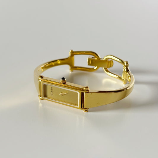 Gucci 1990s Gold Rectangular Dial Gold Plated Bangle Watch