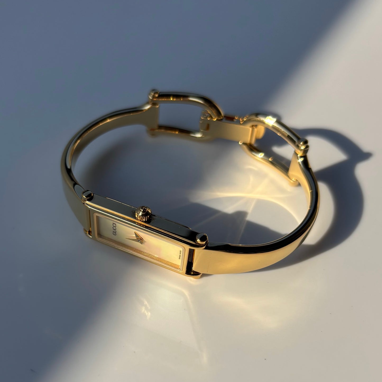 Gucci 1990s Seashell Rectangular Dial Gold Plated Bangle Watch