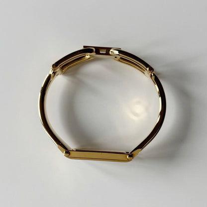 Gucci 1990s Gold Rectangular Dial Gold Plated Bangle Watch (Small)