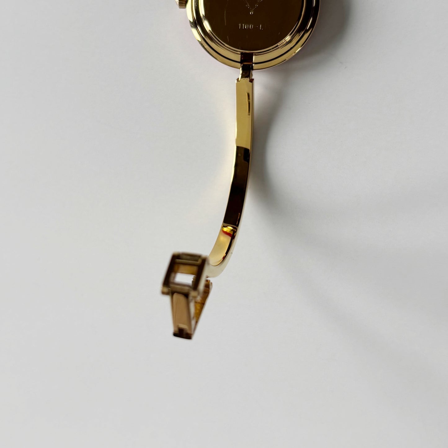Gucci 1990s Interchangeable Bezel Gold Plated Bangle Watch with 12 bezels, case