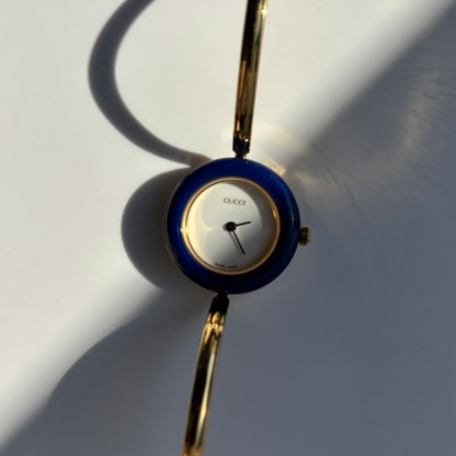 Gucci 1990s Interchangeable Bezel Gold Plated Bangle Watch with 12 bezels, case