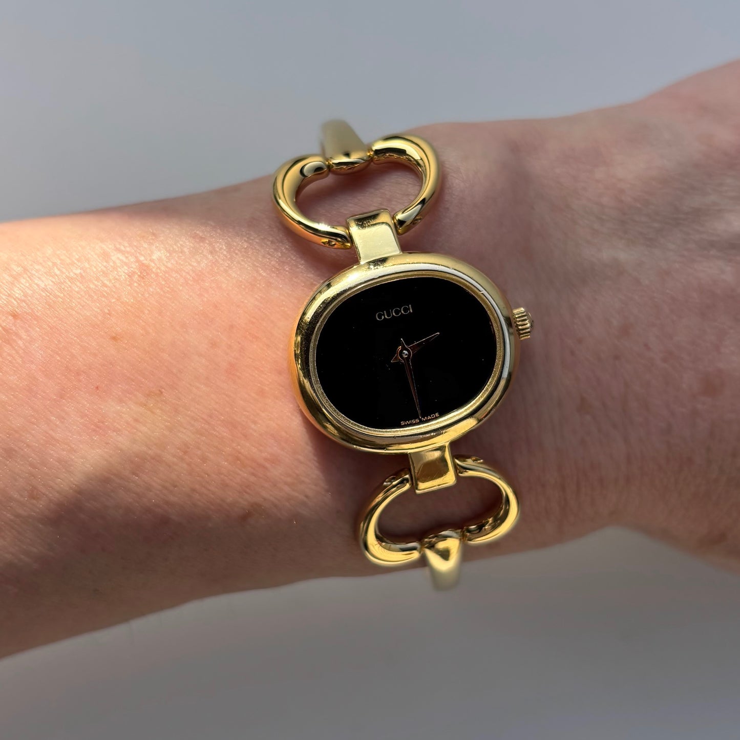 Gucci 1990s Oval Black Dial Gold Plated Bangle Watch (Small)
