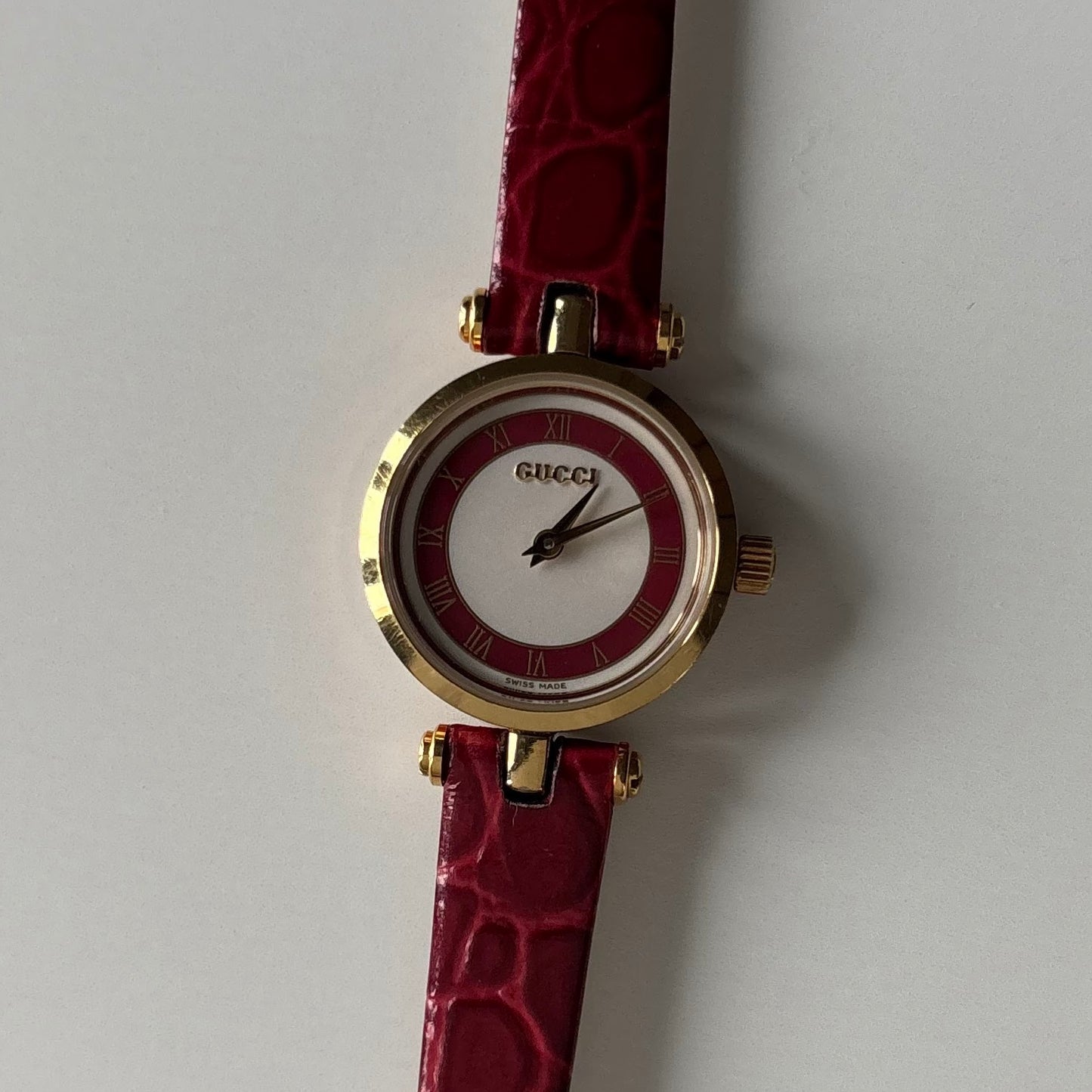 Gucci 1990s Red Dial Sherry Gold Plated Watch