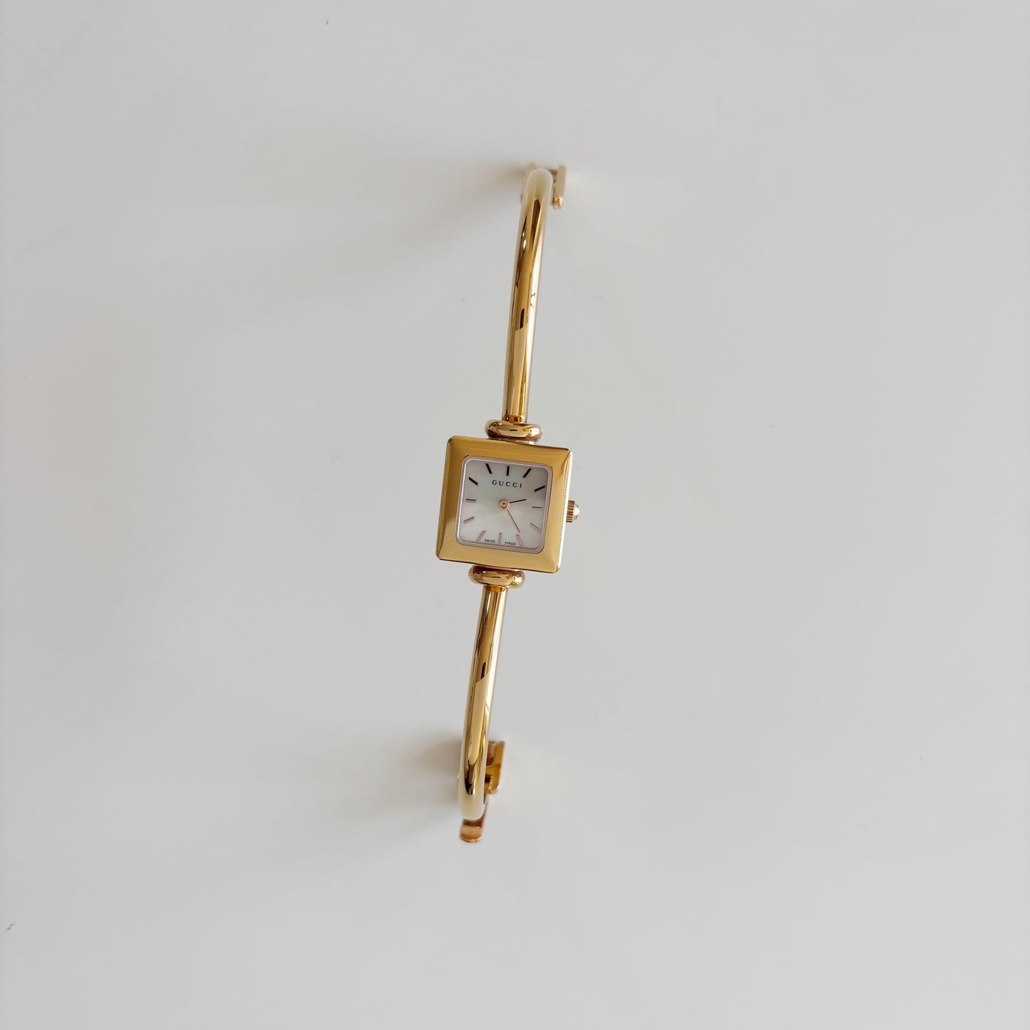 Gucci 1990s Seashell Square Dial Gold Plated Bangle Watch