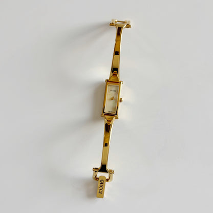 Gucci 1990s Rectangular Seashell Dial Gold Plated Bangle Watch