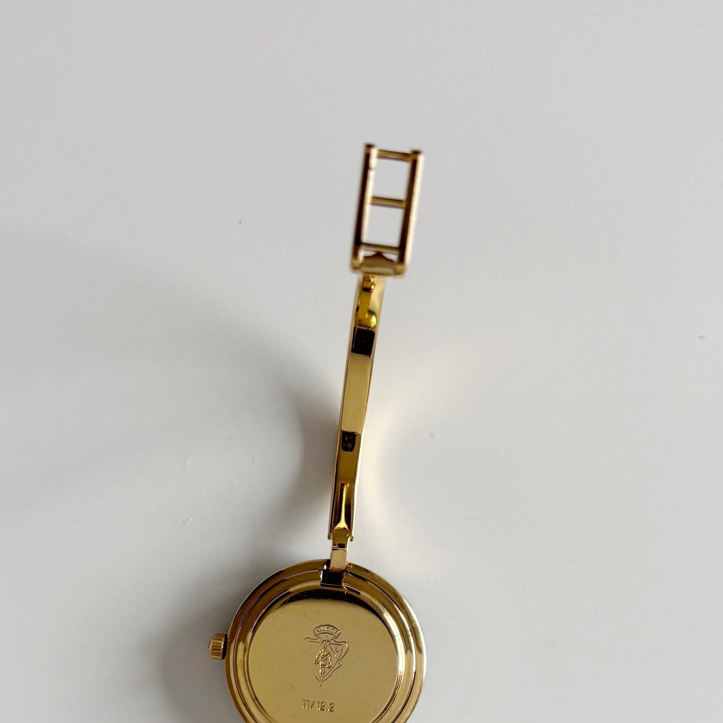 Gucci 1990s Interchangeable Bezel Gold Plated Bangle Watch with 12 bezels, case (Small)