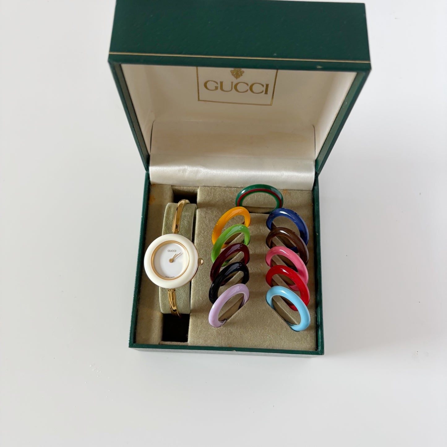 Gucci 1990s Interchangeable Bezel Gold Plated Bangle Watch with 12 bezels, case