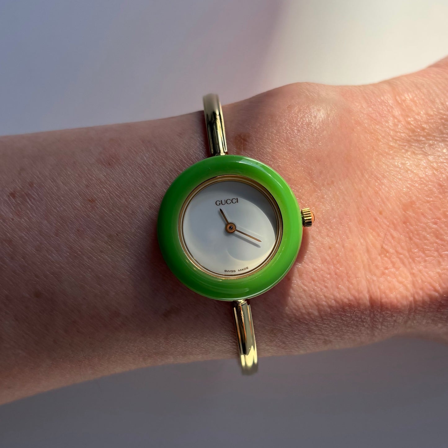 Gucci 1990s Interchangeable Bezel Gold Plated Bangle Watch with 12 bezels, case
