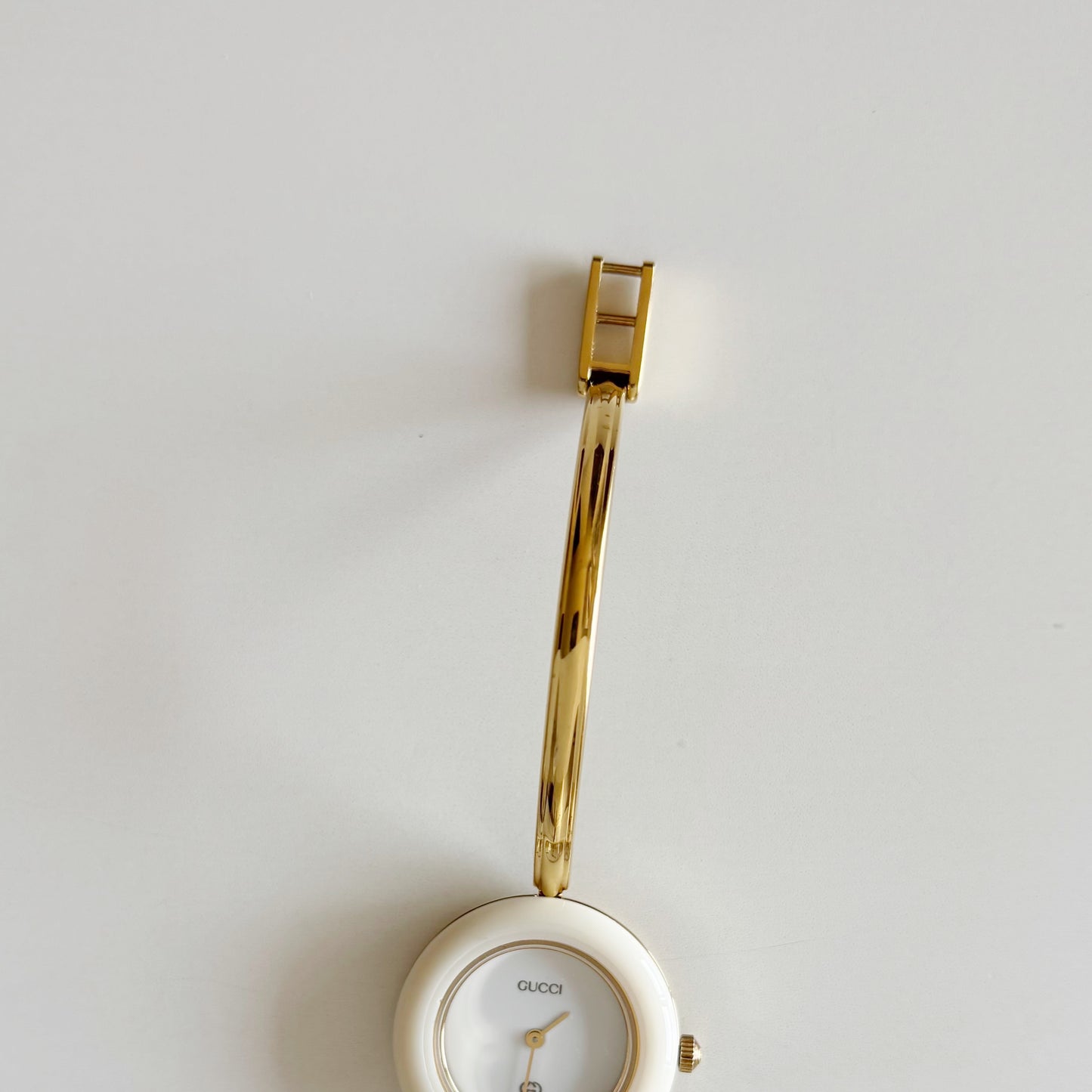 Gucci 1990s Interchangeable Bezel Gold Plated Bangle Watch with 12 bezels, case