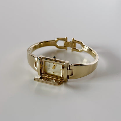 Yves Saint Laurent 1990s Peek-A-Boo Gold Plated Bangle Watch