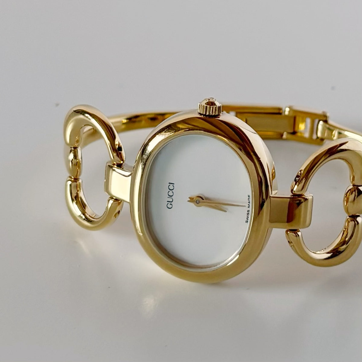 Gucci 1990s Seashell Oval Dial Gold-Plated Bangle Watch (Small)