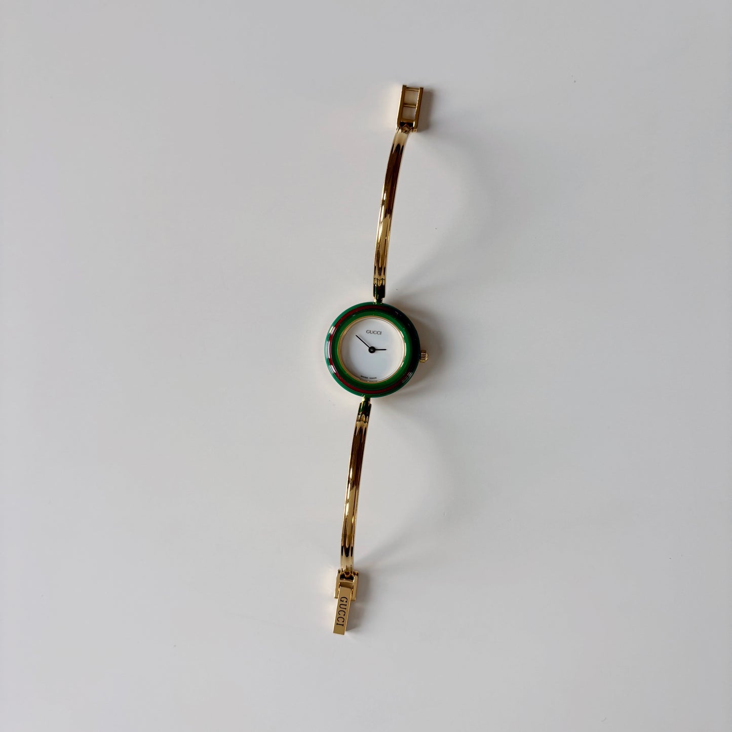 Gucci 1990s Interchangeable Bezel Gold Plated Bangle Watch with 12 bezels, case