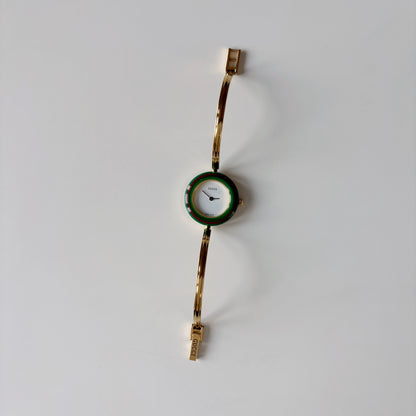 Gucci 1990s Interchangeable Bezel Gold Plated Bangle Watch with 12 bezels, case