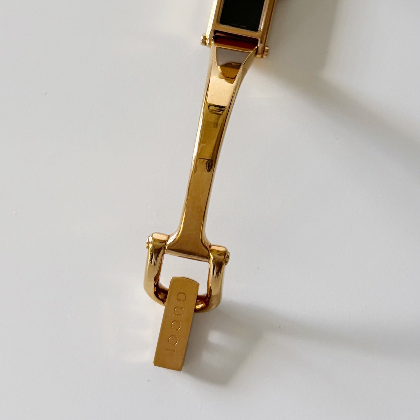 Gucci 1990s Rectangular Black Dial Gold Plated Bangle Watch