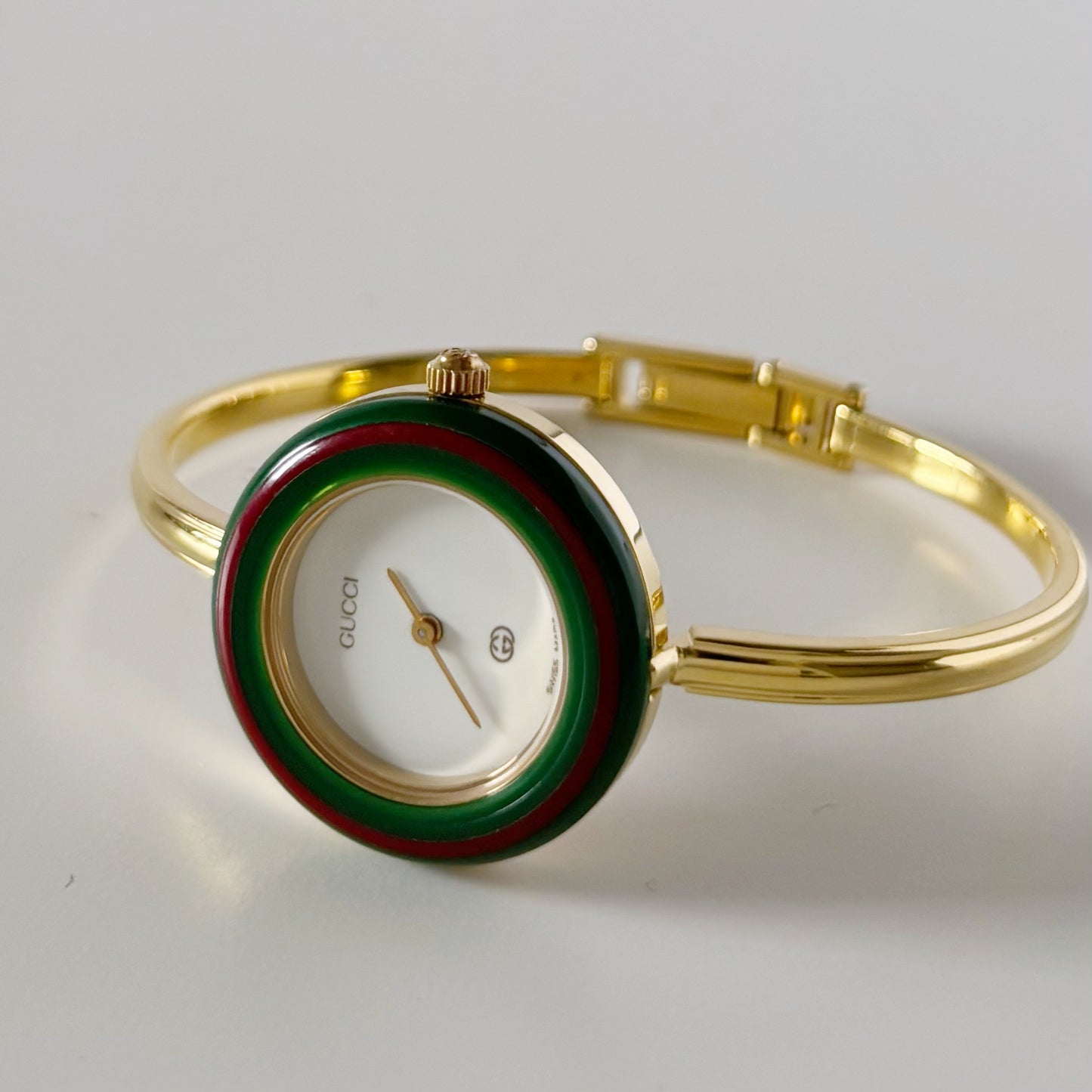 Gucci 1990s Interchangeable Bezel Gold Plated Bangle Watch with 12 bezels, case
