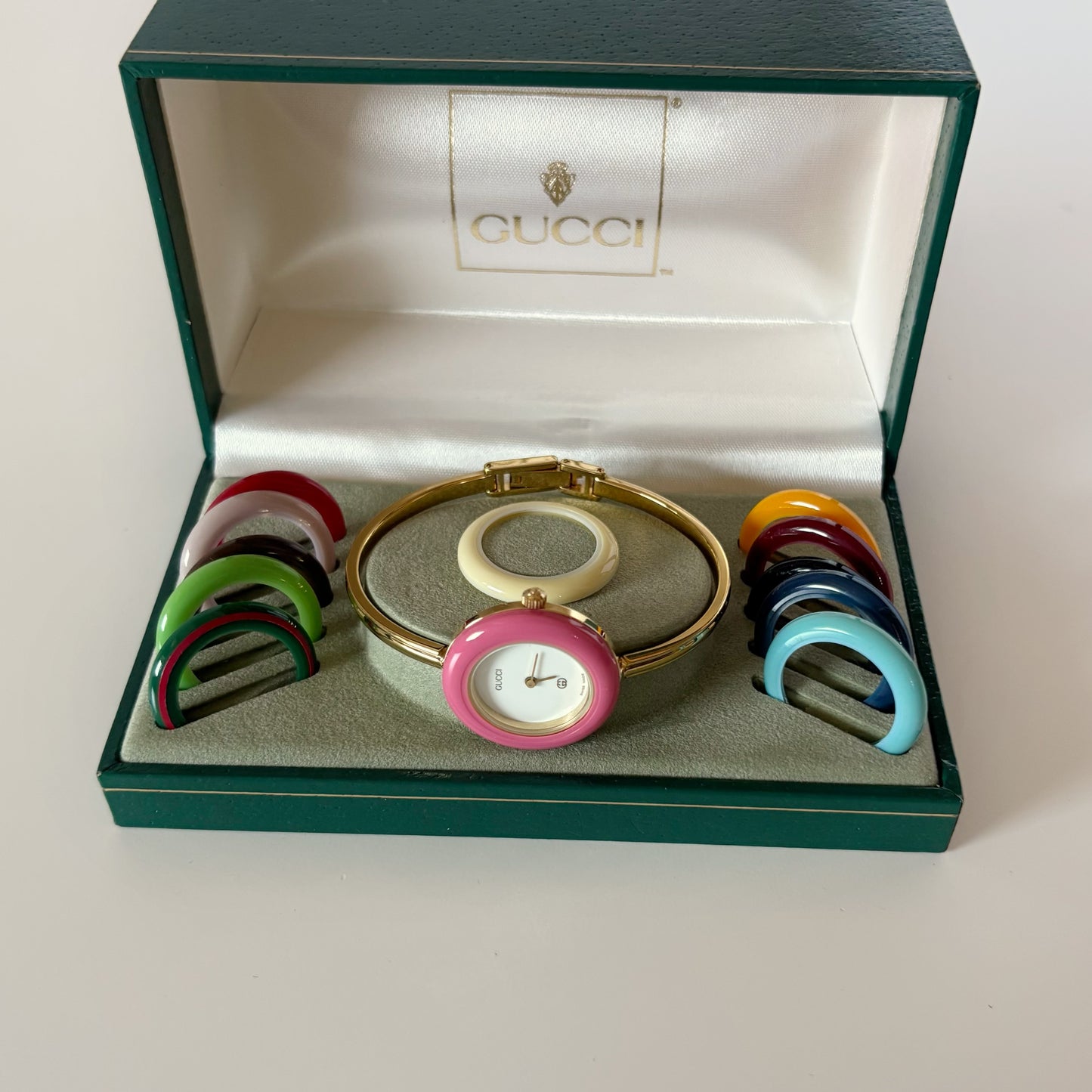 Gucci 1990s Interchangeable Bezel Gold Plated Bangle Watch with 12 bezels, case