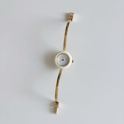 Gucci 1990s Interchangeable Bezel Gold Plated Bangle Watch with 12 bezels, case