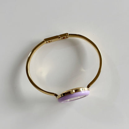 Gucci 1990s Interchangeable Bezel Gold Plated Bangle Watch with 12 bezels, case