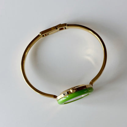 Gucci 1990s Interchangeable Bezel Gold Plated Bangle Watch with 12 bezels, case