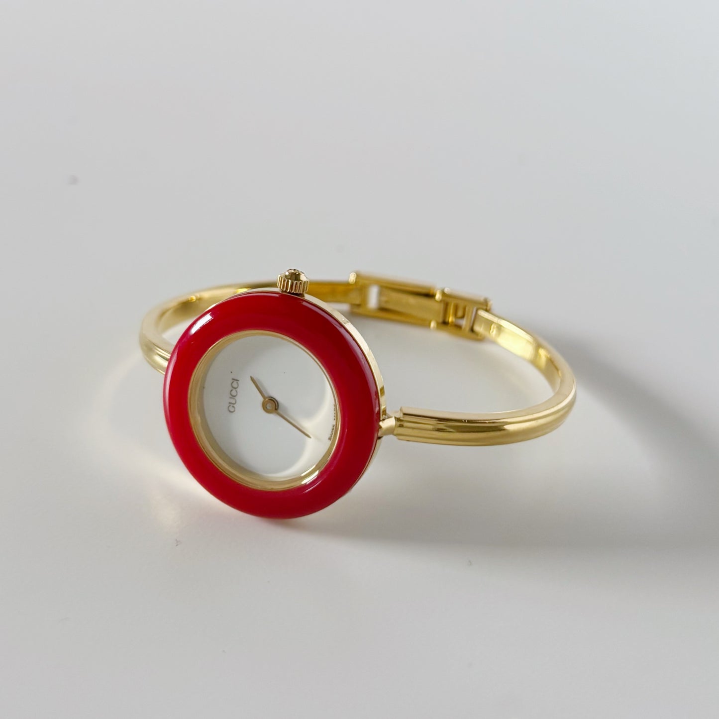 Gucci 1990s Interchangeable Bezel Gold Plated Bangle Watch with 12 bezels, case (Small)