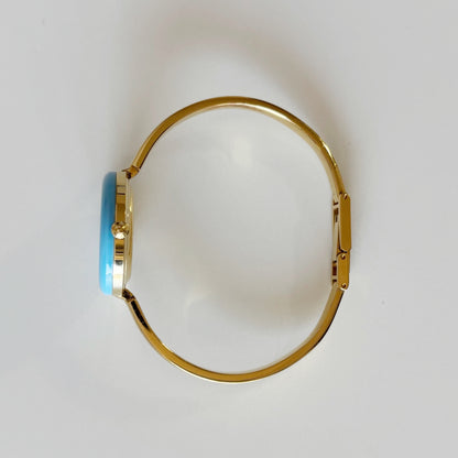 Gucci 1990s Interchangeable Bezel Gold Plated Bangle Watch with 12 bezels, case