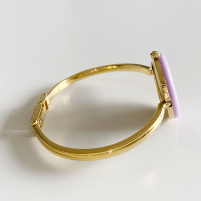 Gucci 1990s Interchangeable Bezel Gold Plated Bangle Watch with 12 bezels, case