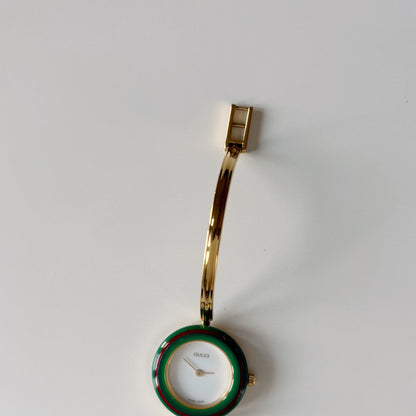 Gucci 1990s Interchangeable Bezel Gold Plated Bangle Watch with 12 bezels, case