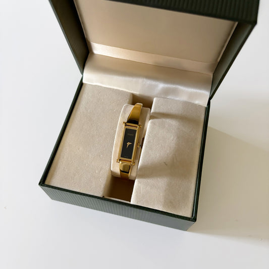 Gucci 1990s Black Dial Rectangular Gold Plated Bangle Watch