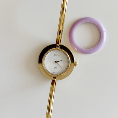 Gucci 1990s Interchangeable Bezel Gold Plated Bangle Watch with 12 bezels, case