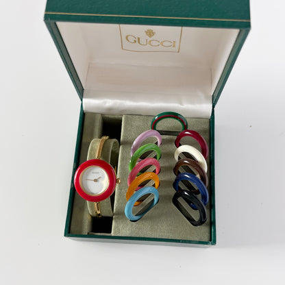 Gucci 1990s Interchangeable Bezel Gold Plated Bangle Watch with 12 bezels, case (Small)