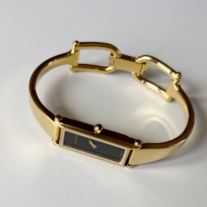 Gucci 1990s Black Rectangular Dial Gold Plated Bangle Watch