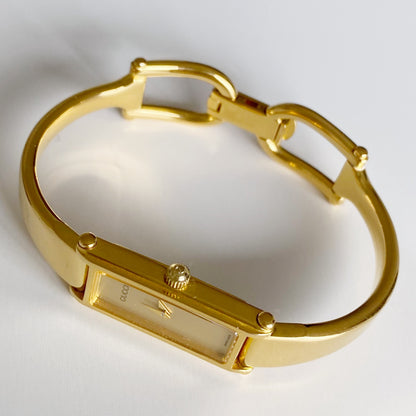 Gucci 1990s Gold Dial Rectangular  Gold Plated Bangle Watch