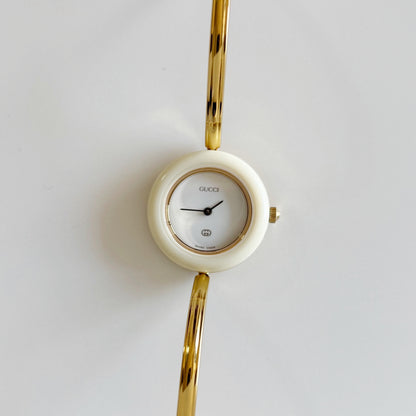 Gucci 1990s Interchangeable Bezel Gold Plated Bangle Watch with 12 bezels, case