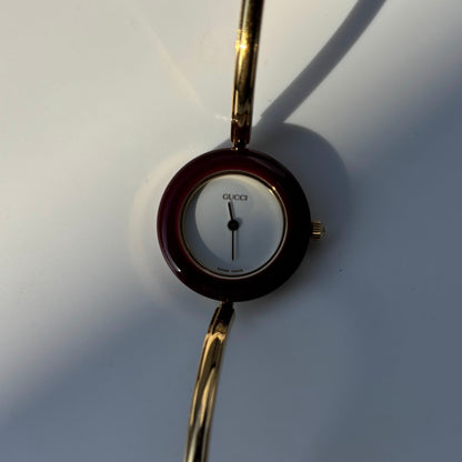 Gucci 1990s Interchangeable Bezel Gold Plated Bangle Watch with 12 bezels, case