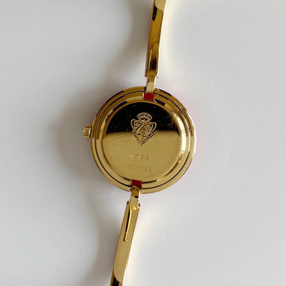 Gucci 1990s Interchangeable Bezel Gold Plated Bangle Watch with 12 bezels, case