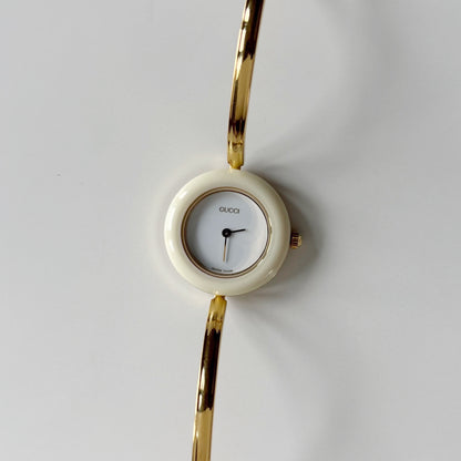 Gucci 1990s Interchangeable Bezel Gold Plated Bangle Watch with 12 bezels, case