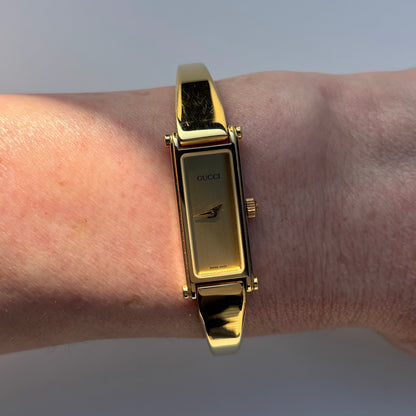 Gucci 1990s Gold Dial Rectangular Gold Plated Bangle Watch