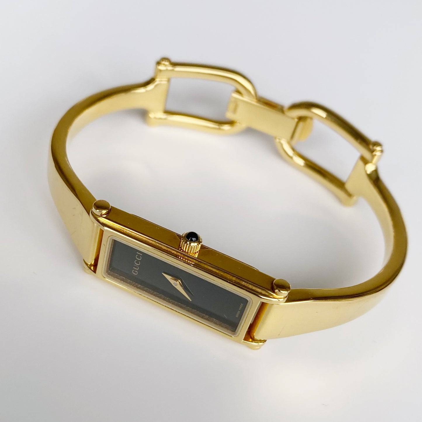 Gucci 1990s Black Dial Rectangular Gold Plated Bangle Watch