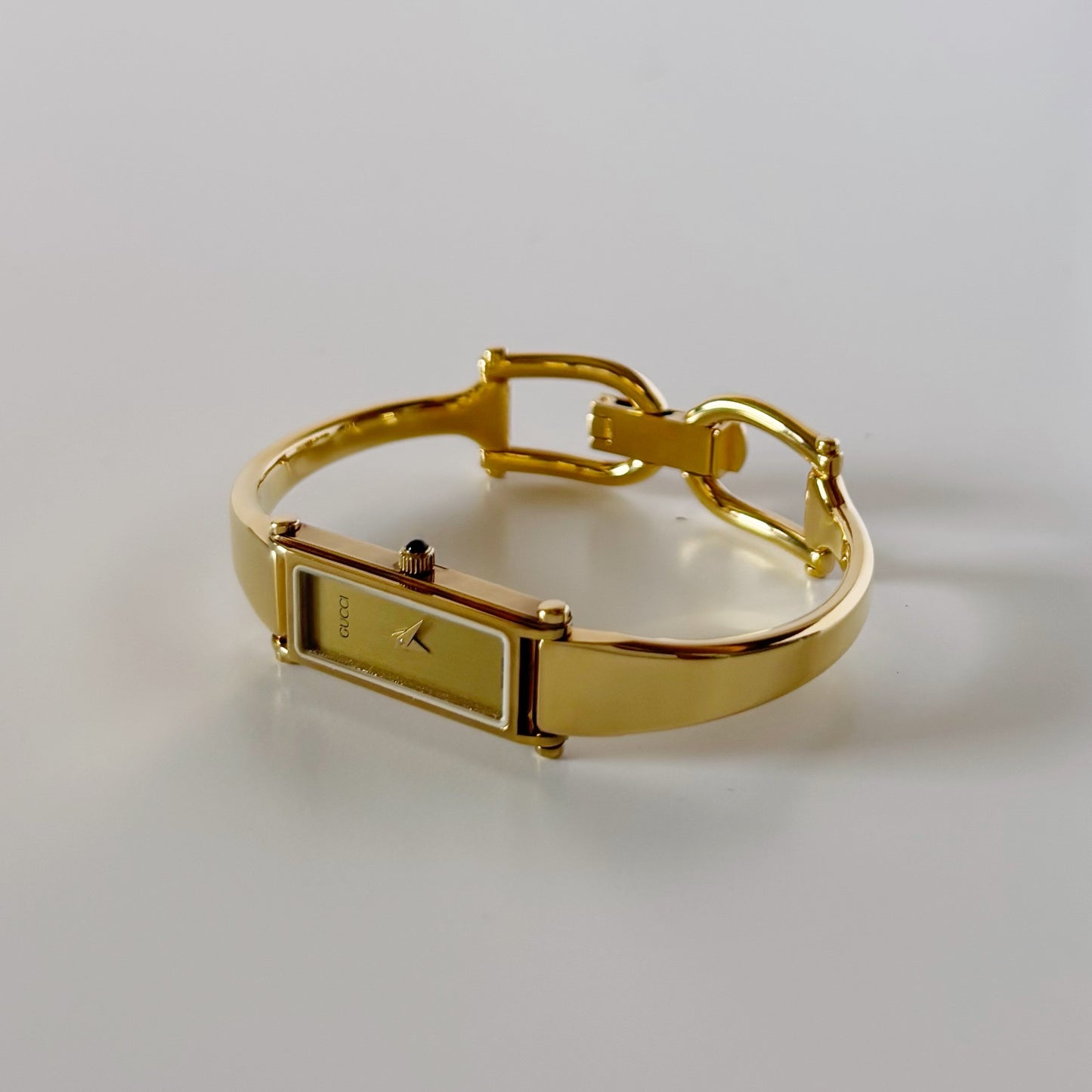 Gucci 1990s Gold Rectangular Dial Gold Plated Bangle Watch