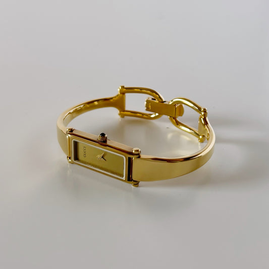Gucci 1990s Gold Rectangular Dial Gold Plated Bangle Watch