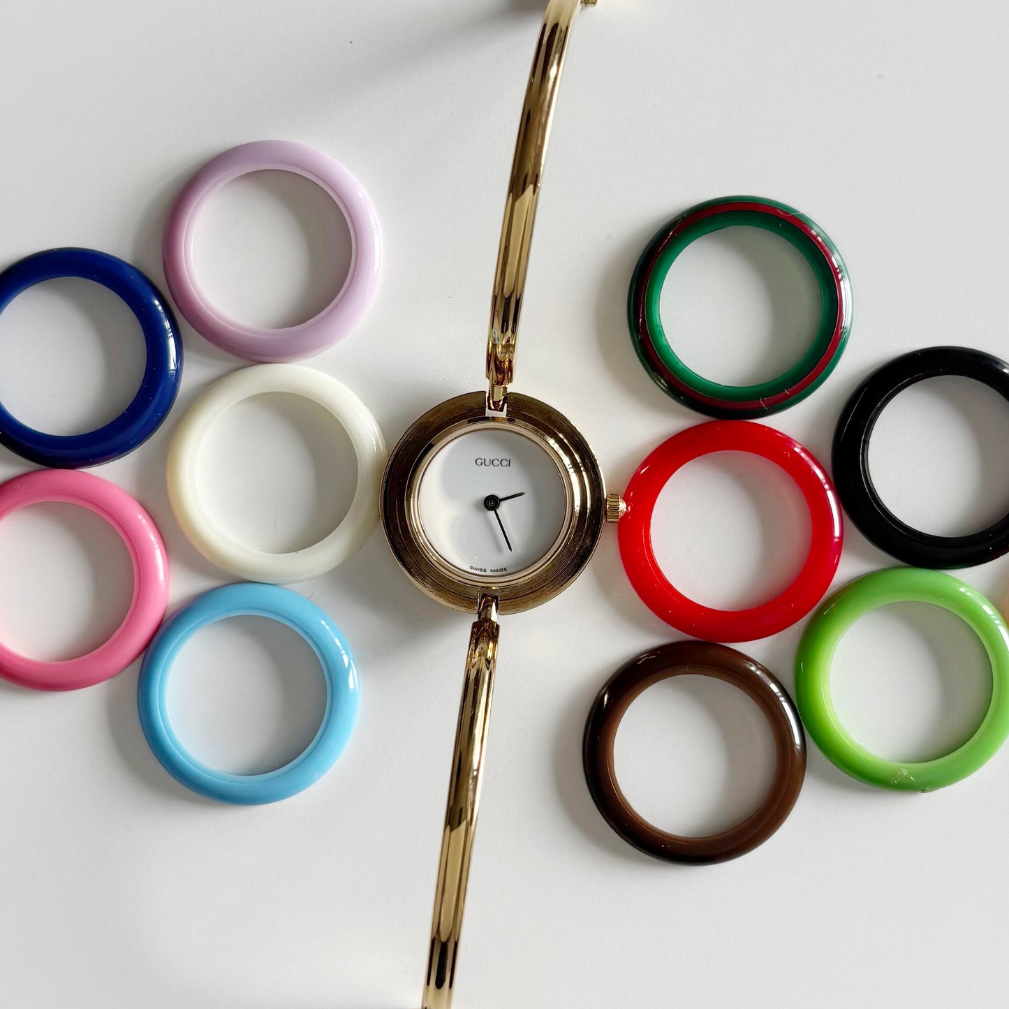 Gucci 1990s Interchangeable Bezel Gold Plated Bangle Watch with 12 bezels, case