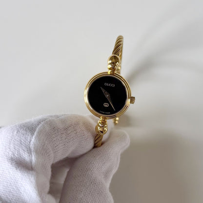 Gucci 1990s Black Round Dial Cable Gold Plated Bangle Watch