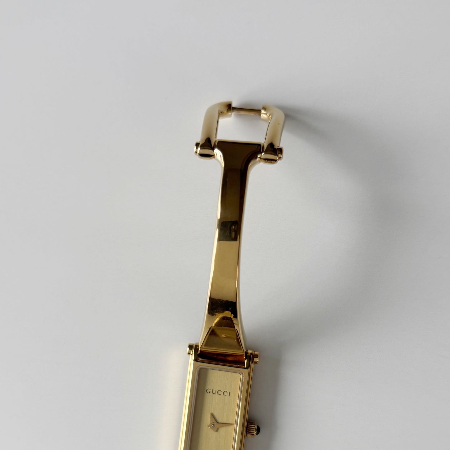 Gucci 1990s Gold Rectangular Dial Gold Plated Bangle Watch (Small)
